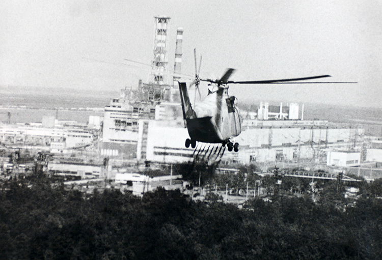 A helicopter sprays decontamination liquid near Chernobyl, 13 June 1986.