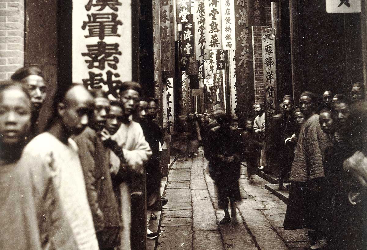 a street in Guangzhou/Canton, 1870s.  Following spread: Chinese ‘dialect’ map, 1987.