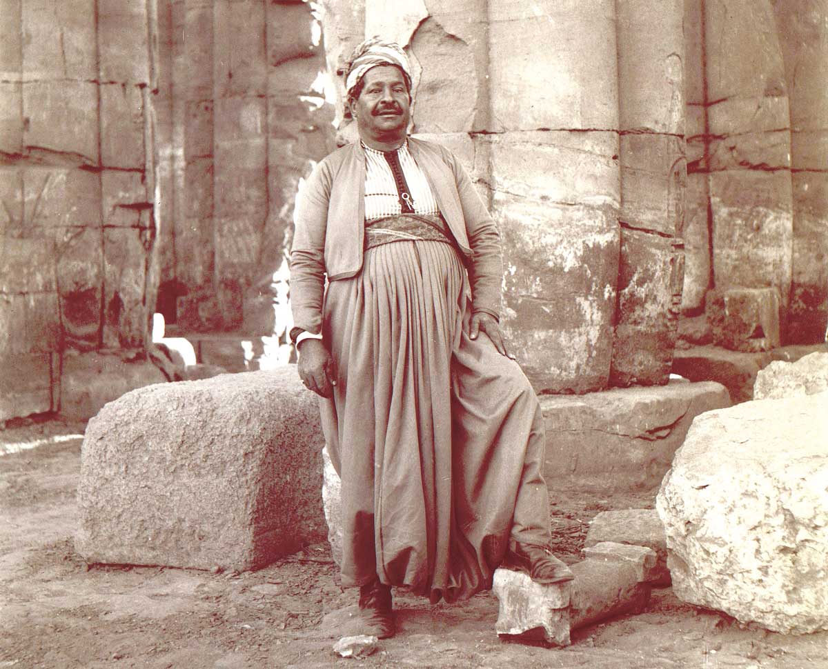 A dragoman in an Egyptian temple, 1880s.