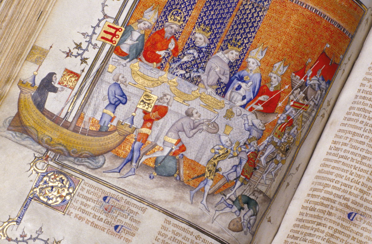 Charles V of France and Emperor Charles IV feast while the Siege of Jerusalem is re-enacted, from the Grandes Chroniques de France, c.1380. Alain Le Toquin/akg-images.