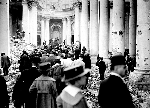Visitors to the ruins of the cathedral at Arras in 1919