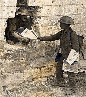 French newsboy selling the Daily Mail to a Canadian soldier. Associated Newspapers