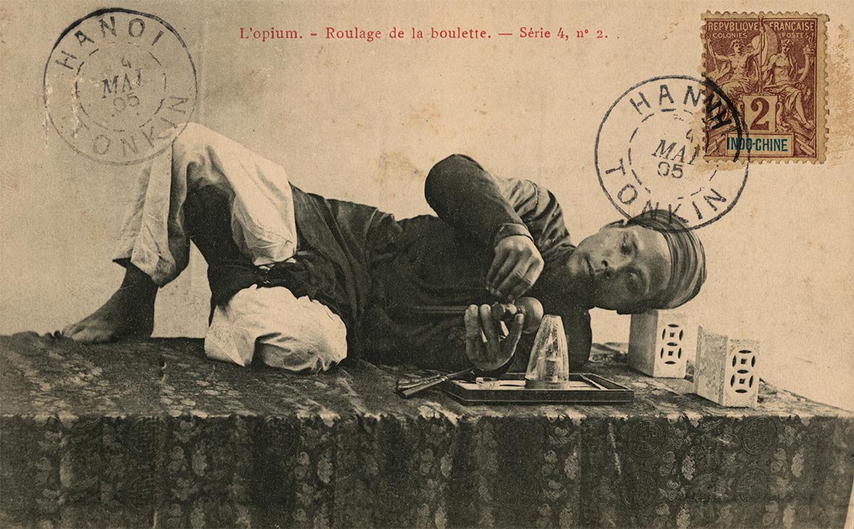 Postcard showing an opium smoker, 1905. © Bridgeman Images.