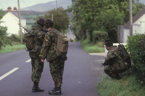 British Soldiers patrol a road leading out of the Irish Republican stronghold of Crossmaglen, September 1985