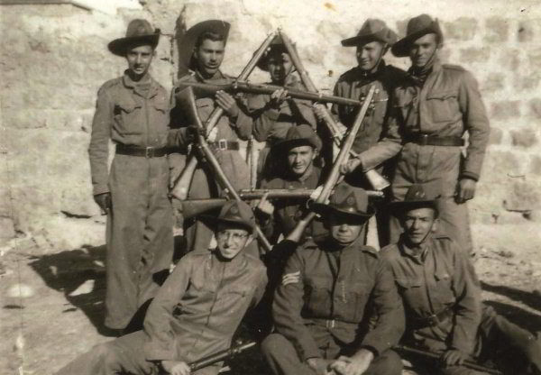 Yehoshua Bar-Hillel, formerly Oscar Westreich (bottom left), with his company in North Africa. They wear the Buffs' Australian slouch hats and defiantly form a Star of David with their rifles