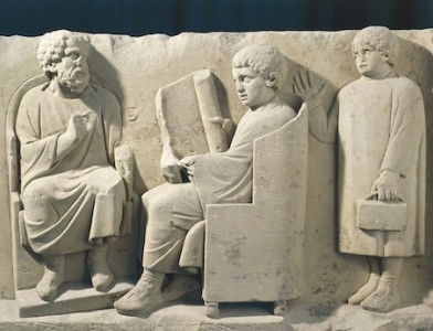 Relief from a burial monument showing a teacher and students, Neumagen, Germany, c.AD 180. G. Dagli Orti/NPL - DeA Picture Library/Bridgeman Images.