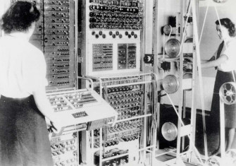 A Colossus Mark 2 codebreaking computer being operated by Dorothy Du Boisson (left) and Elsie Booker (right), 1943. National Archives.