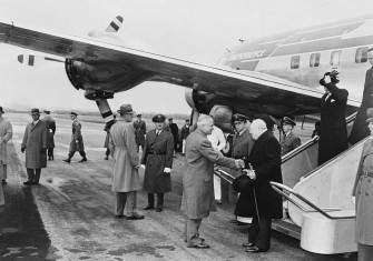 Photograph of President Truman greeting British Prime Minister Winston Churchill upon his arrival at Washington National Airport.