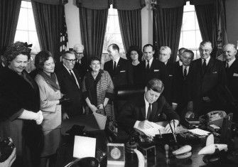 John F. Kennedy signs a proclamation declaring Winston Churchill  an honorary citizen of the US,  9 April 1963.