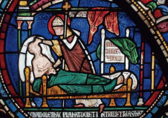 Saint Thomas Becket curing a man in his sickbed, stained glass window (detail), Canterbury Cathedral, early 13th century.