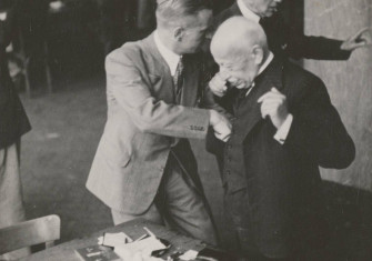 Jewish diamond merchants being searched at the Diamond Exchange, Amsterdam, 16 April 1942.