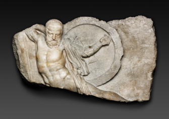 An Athenian-style marble relief of a falling Greek warrior carved during the Roman era, c. AD 101-200. Art Institute of Chicago. Public Domain.