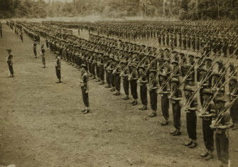 Military parade of Australian soldiers in New Guinea, c.  1943-1944. State Library of Queensland. Public Domain.