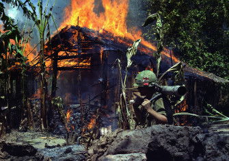 A suspected Viet Cong base camp in Mỹ Tho being razed by the US Army, 5 April 1968. US National Archives. Public Domain.