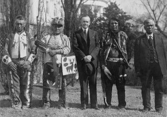 President Calvin Coolidge with Native American delegates, possibly of the Yakama Nation, at the White House, 1925. Library of Congress. Public Domain.