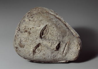 Stone head of a man wearing a cap or helmet, found in Yorkshire, c. 2nd-3rd century. Metropolitan Museum of Art. Public Domain.