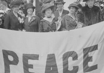 US delegates, including Jane Addams (second from left, front), travel to the International Congress of Women, 1915. Library of Congress. Public Domain.