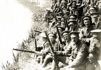 A battalion of the new army resting on a march near Merville, France, H. D. Girdwood, 5 August 1915. British Library. Public Domain.