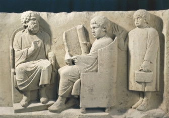 Relief from a burial monument showing a teacher and students, Neumagen, Germany, c.AD 180. G. Dagli Orti/NPL - DeA Picture Library/Bridgeman Images.