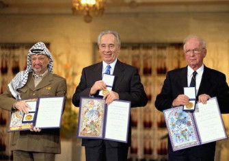 PLO Chairman Yasser Arafat, Israeli foreign minister Shimon Peres, and Israeli prime minister Yitzhak Rabin receive the Nobel Peace Prize, Saar Yaacov, 1994. Government Press Office (CC SA 3.0).