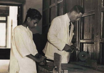 Maharajah Chithira Tirunal and G.T.B. Harvey having a carpentry lesson, c.1930. Archive of Modern Conflict.