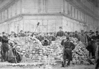  A barricade on Rue Voltaire, after its capture by the regular army during the Bloody Week