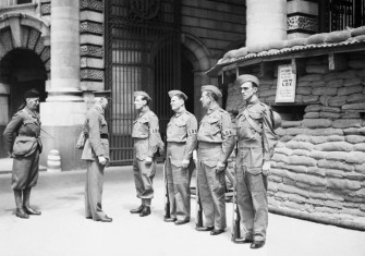 Local Defence Volunteers: The first manned Local Defence Volunteers (LDV) post in central London. The men pictured are being inspected by General Nation and Major Hughman.