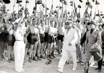 Benito Mussolini and Fascist Blackshirt youth in 1935.