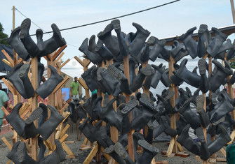 Rubber boots at a Médecins Sans Frontières medical centre, Monrovia, October 18th, 2014. Zoom Dosso / Stringer / Getty Images