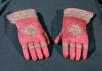 Glad hands: a pair of late 15th-century knitted silk and gold-thread gloves.
