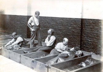 Men in 'coffin beds'.