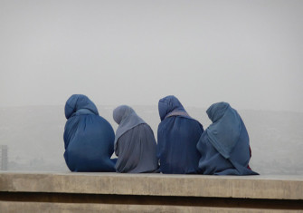 Young women gazing at Kabul from its hills, c.2014.