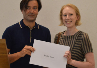 Emily Jones receives her prize from editor Paul Lay. 