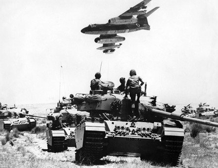 An Israeli Vautour  bomber flies over tanks assembling in the Negev desert on May 24th,  1967, two weeks before the outbreak of the  Six Day War.  © Topfoto