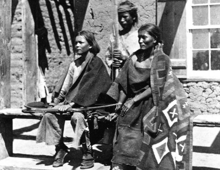 A Navajo woman and  two young men at Ford Defiance, in what was then New Mexico, 1873.