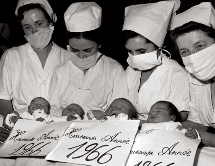 Nurses at the Baudelocque Maternity Hospital in Paris presenting babies born on New Year’s Eve, 1965 © AFP/Getty Images.