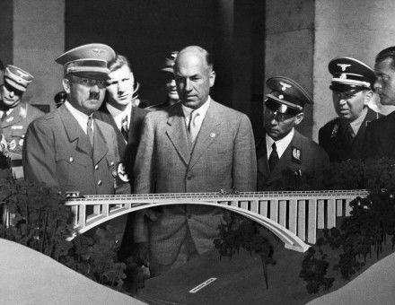 Hitler with Todt (centre) and Speer (far right) looking at the model of a motorway viaduct, 3 October 1937.