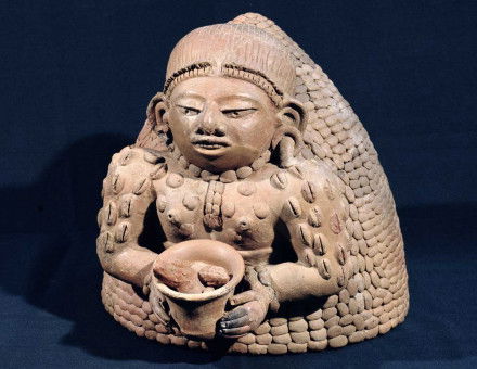 Woman holding cacao (and decorated with cacao beans), Maya, AD 250-450 © Bridgeman Images.