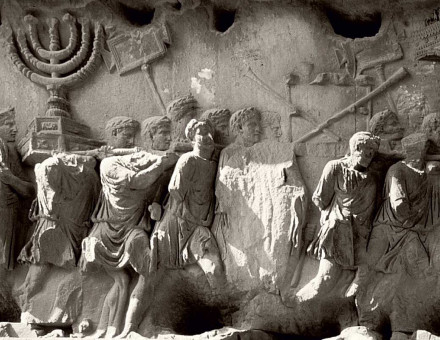 Frieze panel showing triumphant Romans carrying the seven-branched menorah from the Temple of Jerusalem from the Arch of Titus, Rome © Werner Forman Archive/Getty Images.