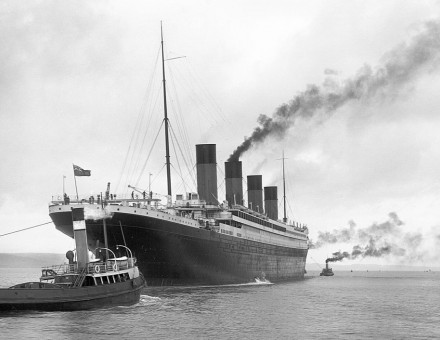 Titanic leaving Belfast with two guiding tugs visible