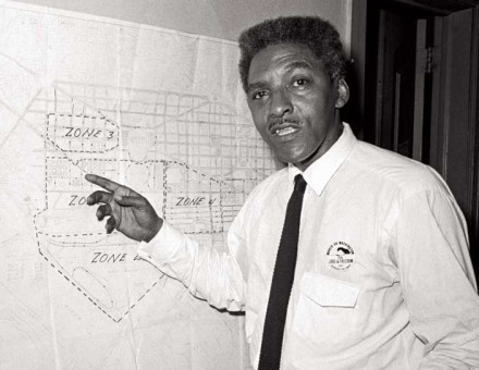 Bayard Rustin with  a map showing the route of the March on Washington, 13 August 1963.