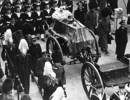 The coffin of King George VI lies on a gun carriage drawn by naval officers, and accompanied by men of the Household Cavalry on Feb 15, 1952