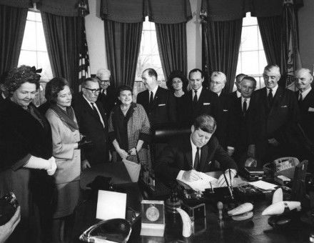 John F. Kennedy signs a proclamation declaring Winston Churchill  an honorary citizen of the US,  9 April 1963.