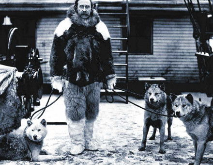 Explorer Robert E. Peary and husky aboard the Roosevelt, c.1909.