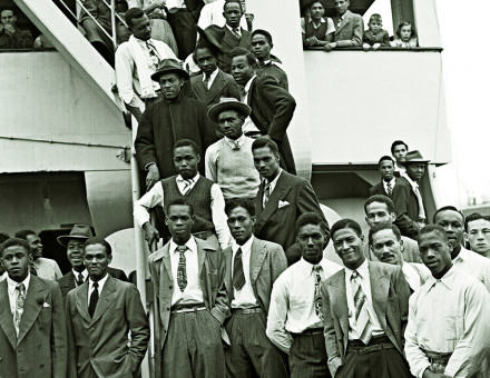 Jamaican men,  many of them former RAF servicemen, disembark Empire Windrush at Tilbury Docks, 22 June 1948.