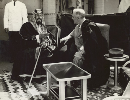 King Ibn Saud of Saudi Arabia and President Franklin D. Roosevelt converse on the deck of a U.S. warship in the Great Bitter Lake near Cairo after Roosevelt's attendance at the Yalta conference.