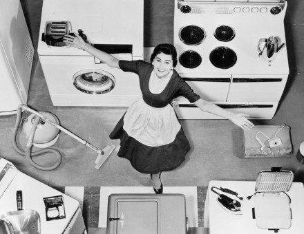 A woman models kitchen appliances in the late 1950s. From the Carolina Power and Light Photo Collection, State Archives of North Carolina. Public Domain.