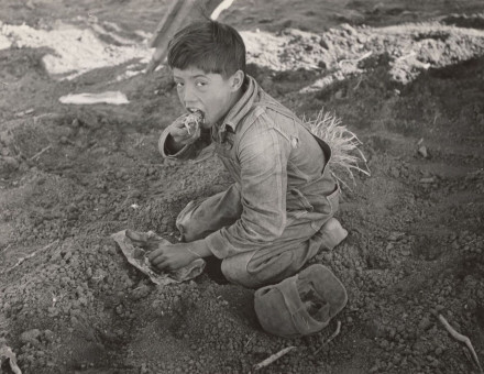 young Mexican agricultural worker eats a tortilla in a field near Santa Monica, Texas, 1939. New York Public Library. Public Domain.
