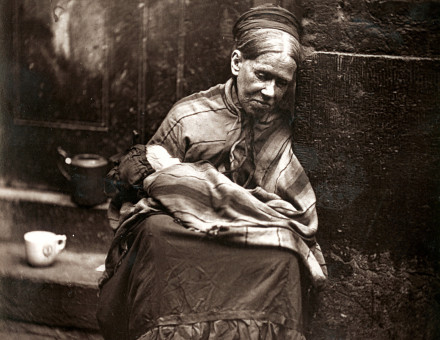 An old woman sits in a doorway, from 'Street Life in London' by John Thomson and Adolphe Smith, 1877. LSE Library. Public Domain.