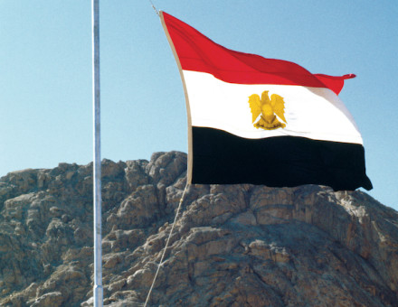Anwar Sadat raises the Egyptian flag over Sinai, 26 May 1979. William Karel/Getty Images.